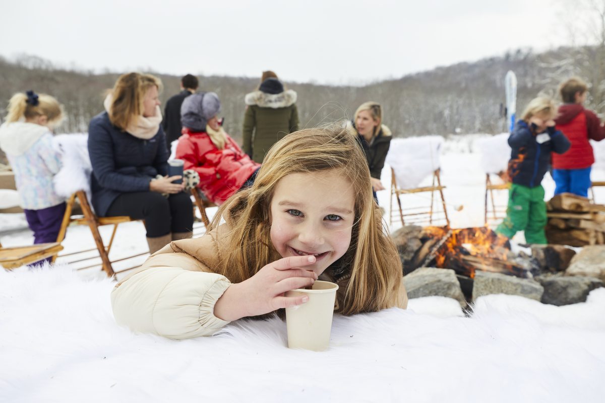 Joyful child at winter outdoor celebration