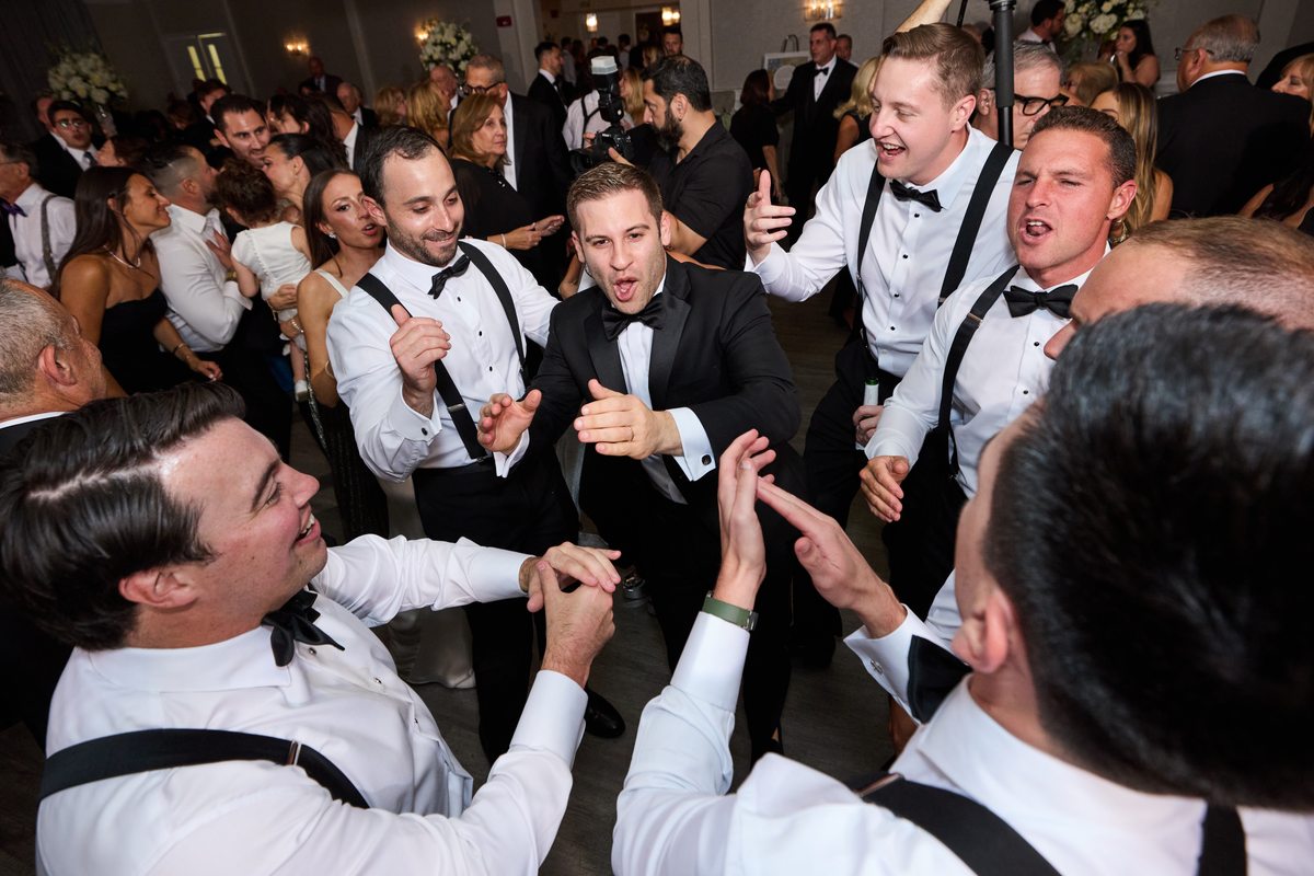 Groom celebrating on the dance floor